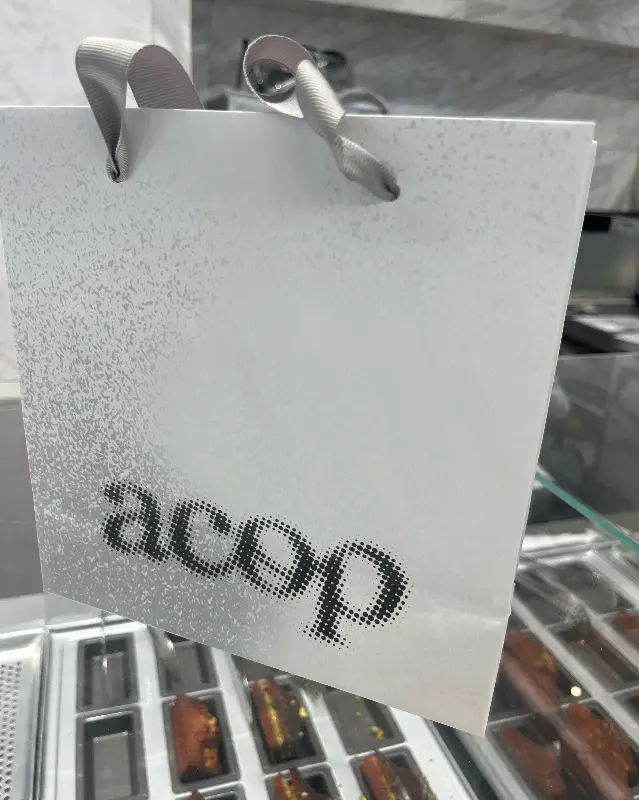 acop 로고가 박힌 쇼핑백